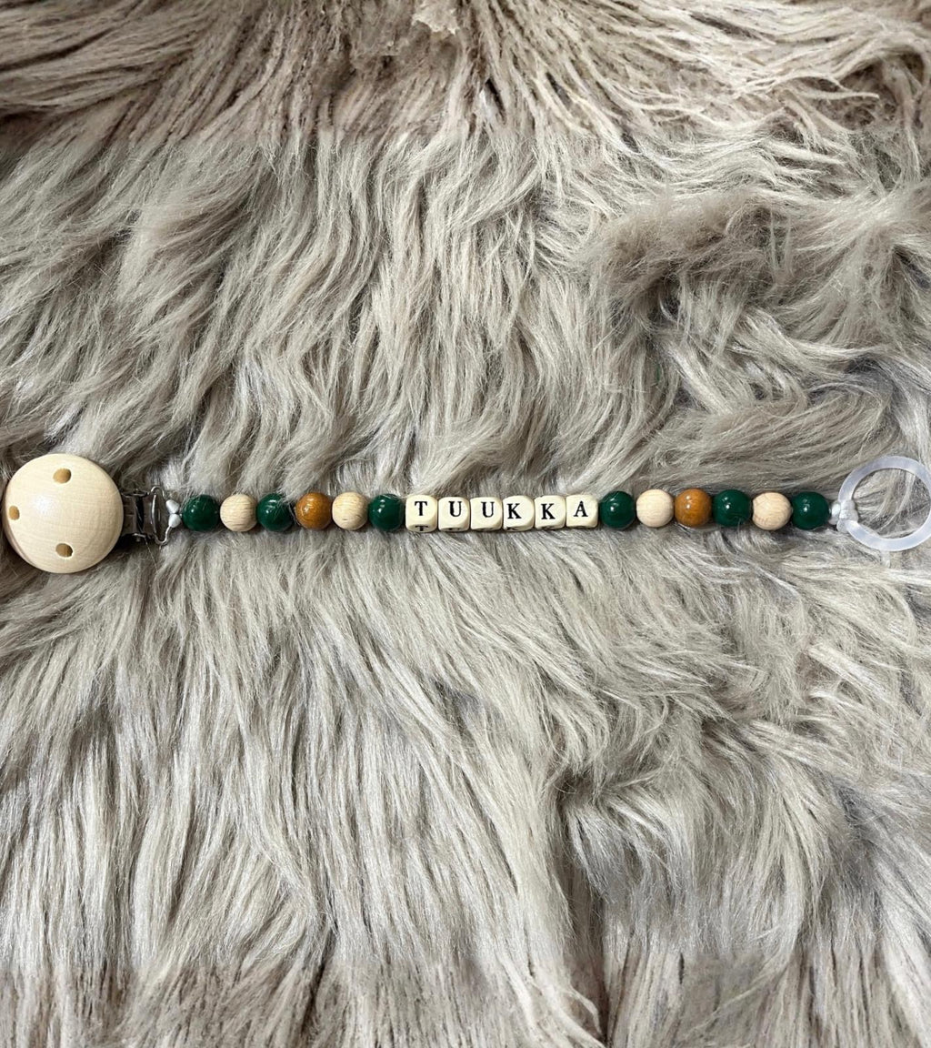 Metsänvihreä tuttinauha