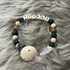 Metsänvihreä tuttinauha