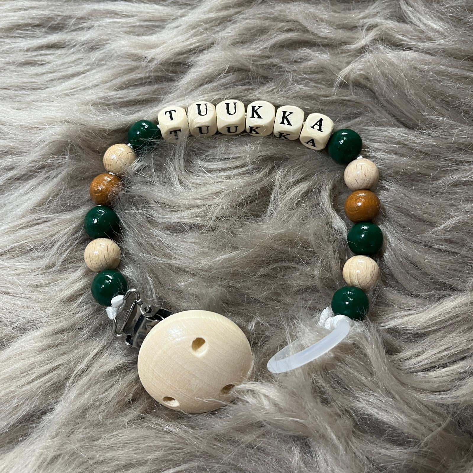 Metsänvihreä tuttinauha